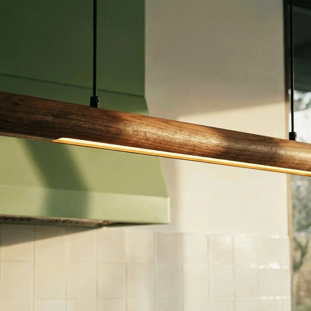 Svelte Walnut Pendant Light, shown in scale within a hallway